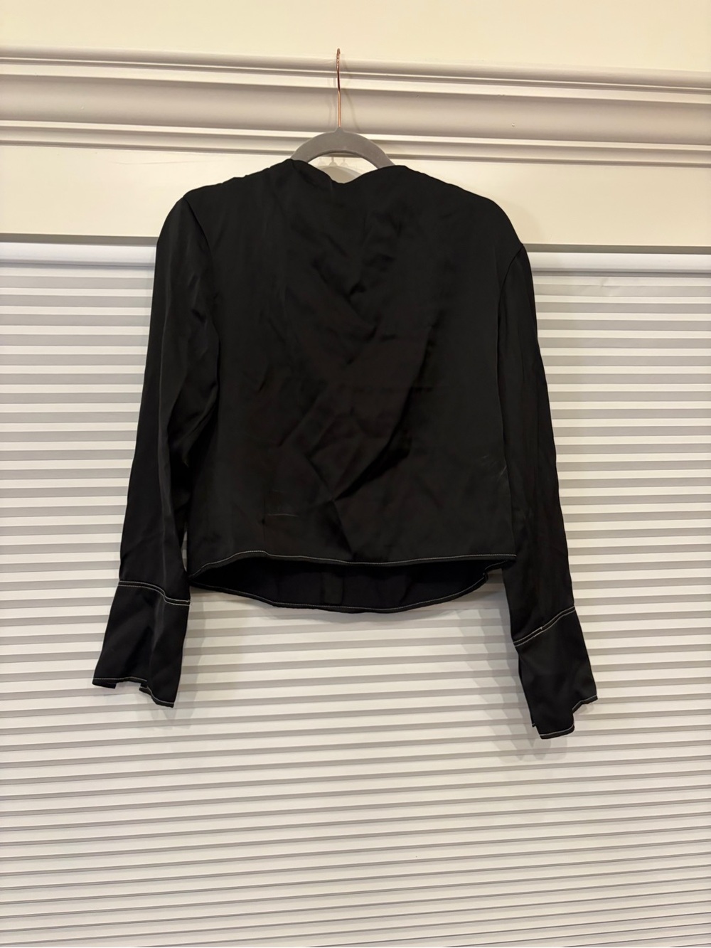 H&M black blouse with white stitching